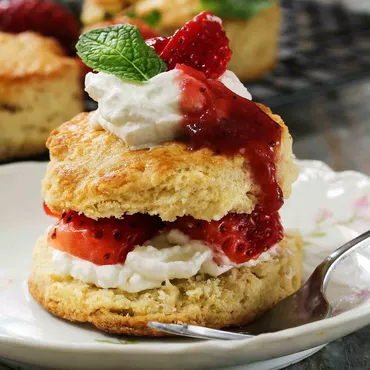 freshly baked strawberry shortcakes with whipped cream