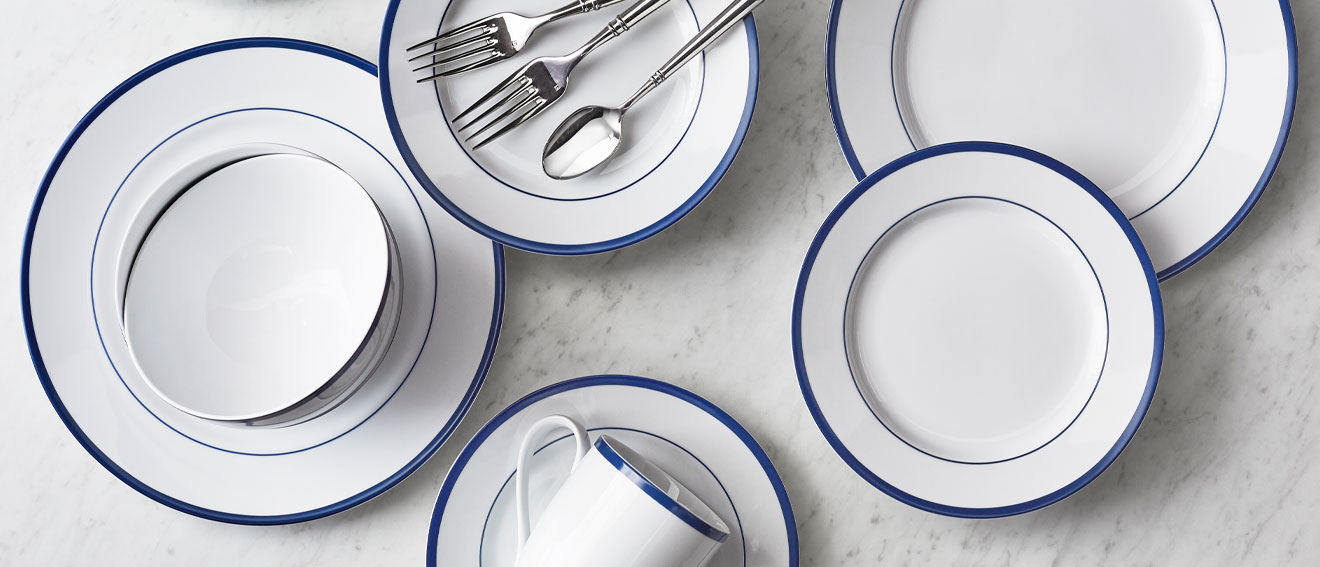 white dinnerware with blue border