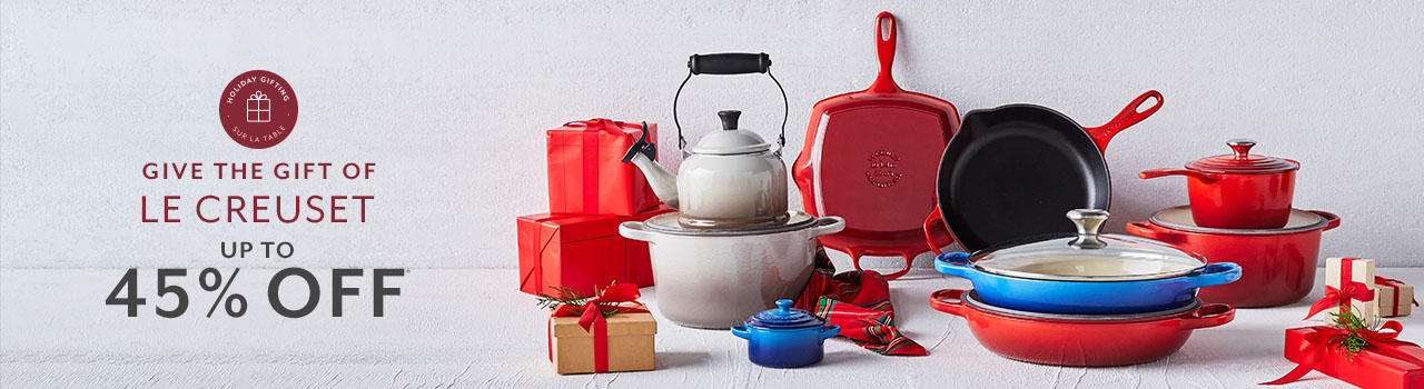 The gift of Le Creuset up to 45% off. Le Creuset colorful cookware with red gift boxes.