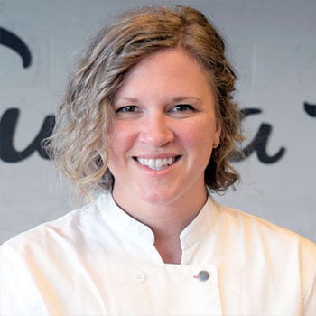 MEREDITH ABBOTT in white chef coat