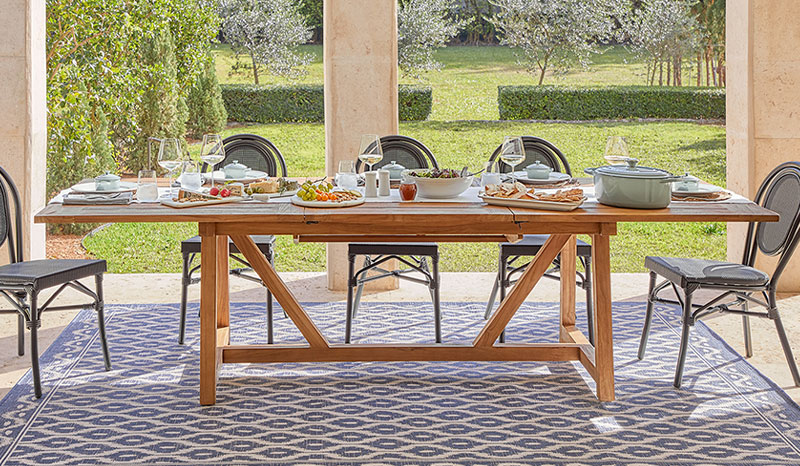 Fete teak dining table and woven rattan chairs