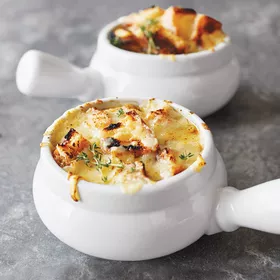 French Onion Soup in white porcelain bowl with handle