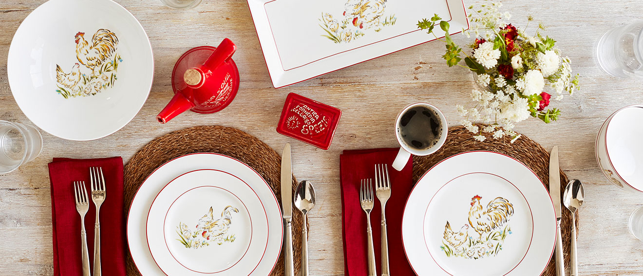 white dinnerware with chicken motif