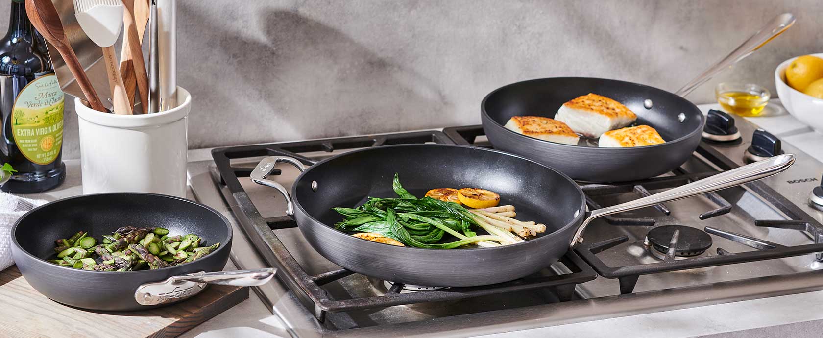 All-Clad set of three nonstick skillets on cooktop