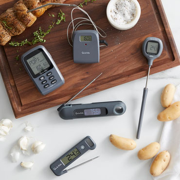 Thermometers and roast on cutting board