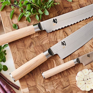 Cangshan Haku chef knife on cutting board