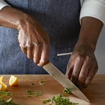 chef chopping herbs