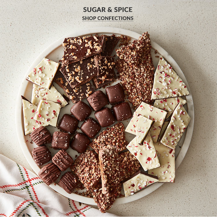 Christmas candy and chocolate bark on white serving platterd on plate