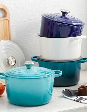 Le Creuset deep Dutch ovens stacked