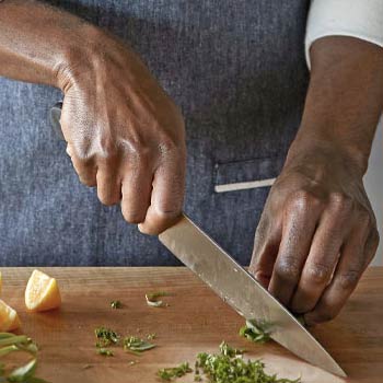 chef chopping herbs