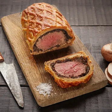 Beef Wellington on cutting board