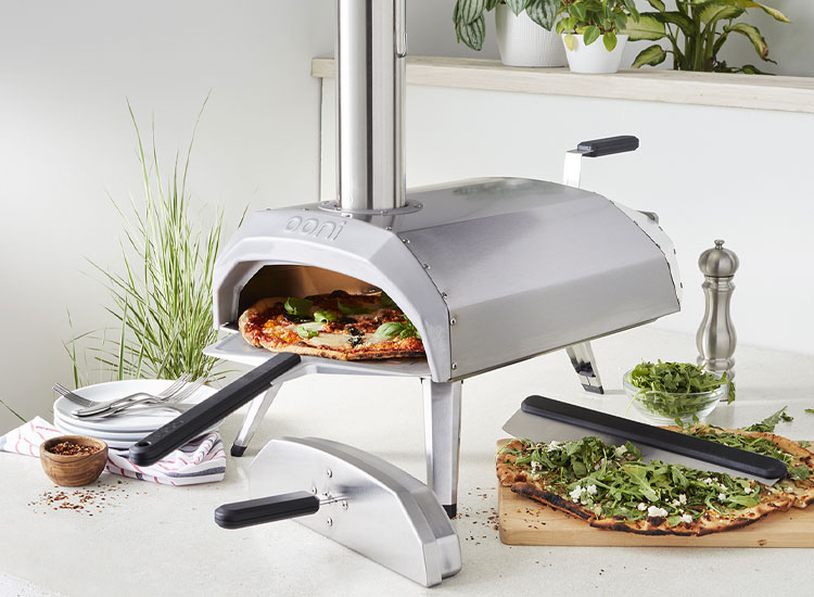 Ooni pizza oven with pizza peel and cutter