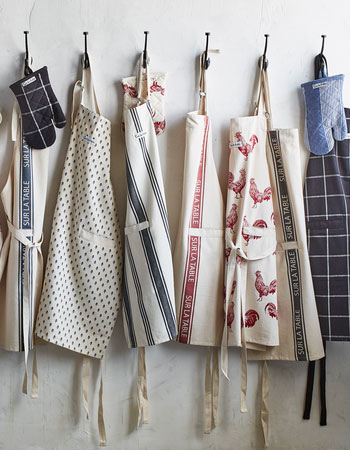 Fall aprons hanging on hooks